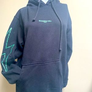 Shadow Hill black sweatshirt w green lightning bolts on both sleeves